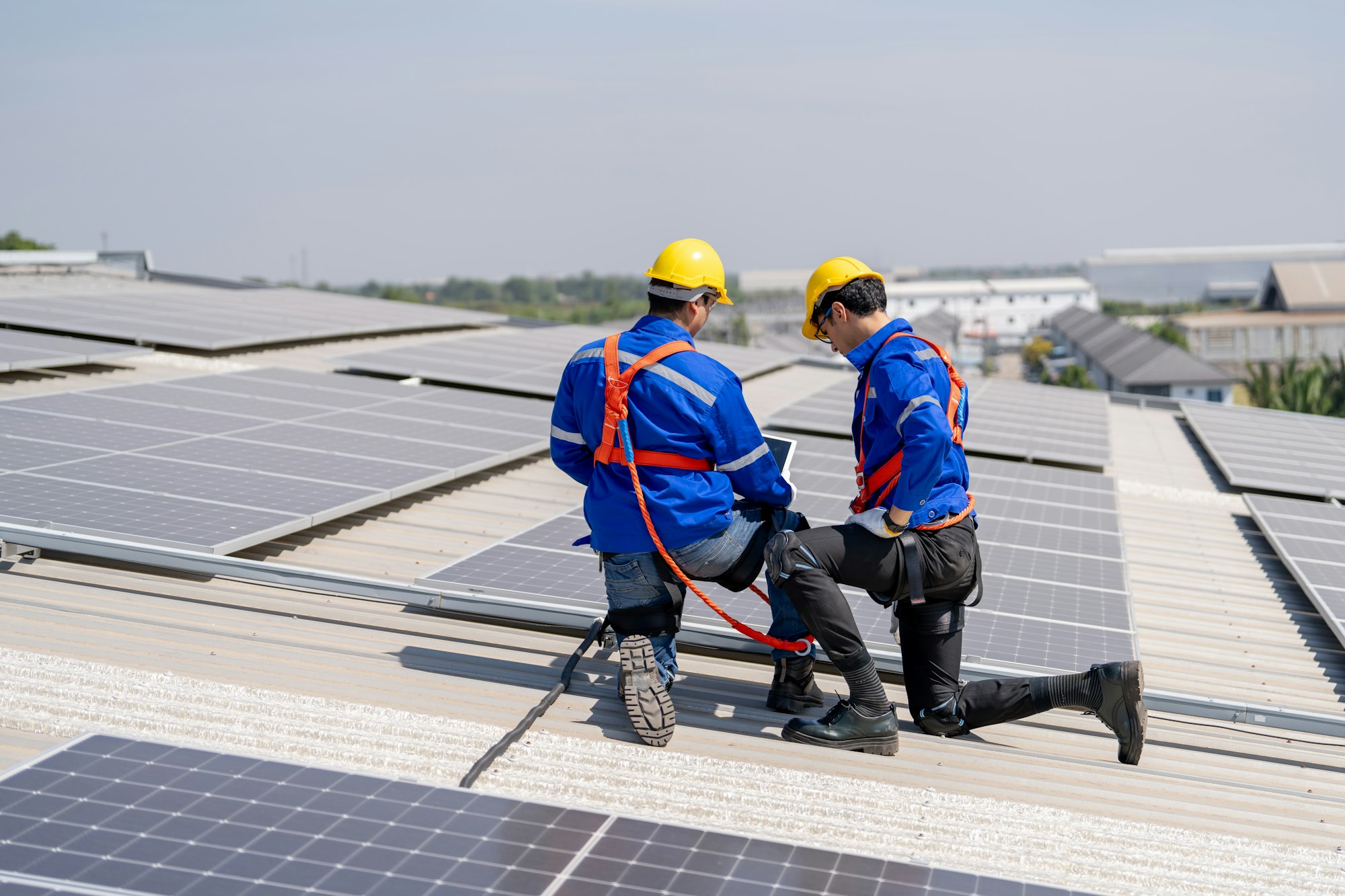 Engineer working setup Solar panel at the roof top. Engineer or worker work on solar panels or solar